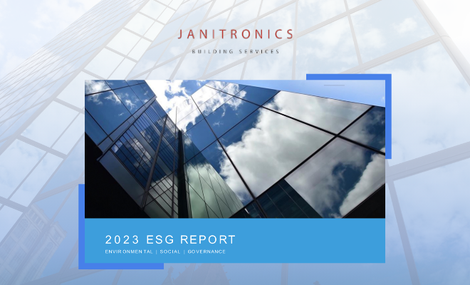 Cover design for Janitronics’ Environmental, Social, and Governance (ESG) report featuring skyscraper reflections
